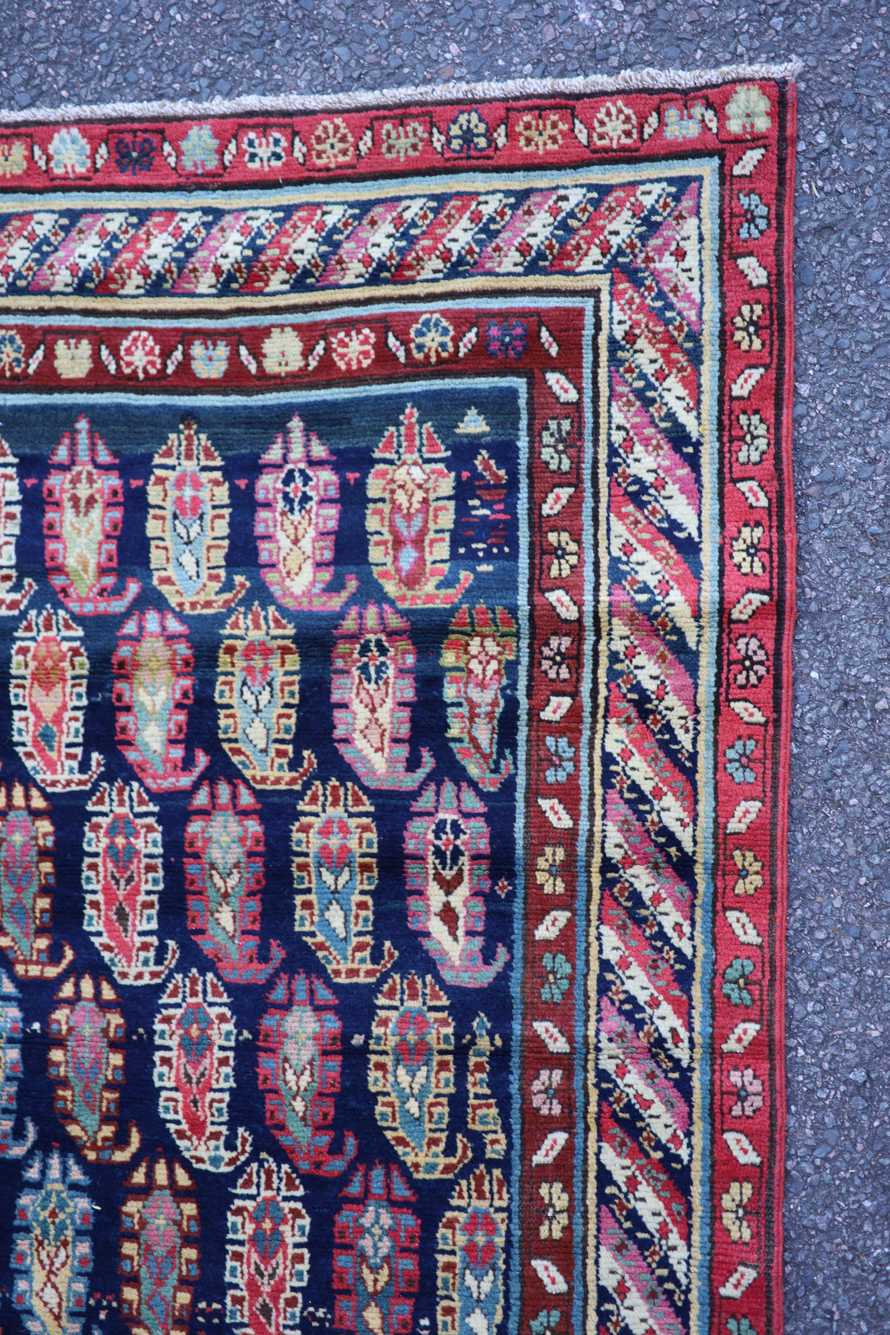 An antique Karabagh blue ground runner, late 19th century 355 x 106